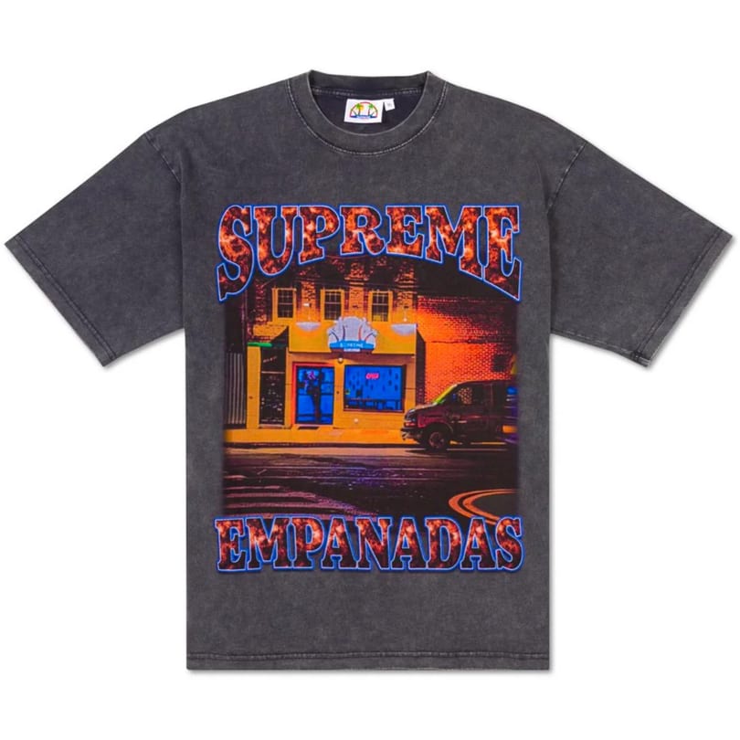 A dark gray t-shirt with a graphic of the Supreme Empanadas storefront at night.